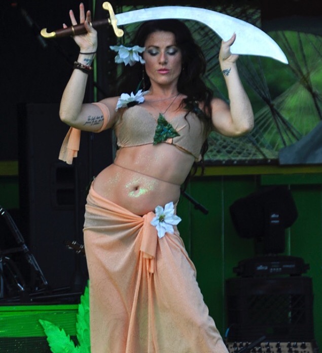 Katherine performing a dance on stage